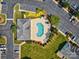 Aerial view of community pool featuring manicured landscaping and a community building at 1504 Harpers Inlet Dr, Lake Wylie, SC 29710