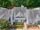 Aerial view of home featuring mature landscaping and a walkway to the front door at 1504 Harpers Inlet Dr, Lake Wylie, SC 29710