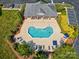 Aerial view of community pool featuring ample lounge chairs and manicured landscaping at 1504 Harpers Inlet Dr, Lake Wylie, SC 29710