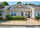 Charming townhouse with well-maintained landscaping, neutral siding, and inviting front porch at 1504 Harpers Inlet Dr, Lake Wylie, SC 29710