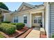 Inviting townhouse entrance with a cozy front porch, well-kept shrubbery, and visible house number at 1504 Harpers Inlet Dr, Lake Wylie, SC 29710