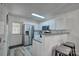 Bright kitchen featuring stainless steel appliances, granite countertops, and white cabinetry at 1504 Harpers Inlet Dr, Lake Wylie, SC 29710