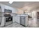 Modern kitchen with stainless appliances, granite countertops, open layout, and natural light at 1504 Harpers Inlet Dr, Lake Wylie, SC 29710
