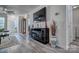 Open-concept living room with fireplace, large screen television, and stylish decorations at 1504 Harpers Inlet Dr, Lake Wylie, SC 29710