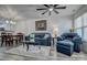 Cozy living room with plush seating, ceiling fan, and adjacent dining area at 1504 Harpers Inlet Dr, Lake Wylie, SC 29710