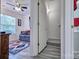View from hallway showing living room with ceiling fan, couch and rug at 1504 Harpers Inlet Dr, Lake Wylie, SC 29710