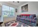Living room featuring a large window, comfortable couch and decorative rug at 1504 Harpers Inlet Dr, Lake Wylie, SC 29710