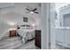 Main bedroom with ceiling fan, bedside tables and ensuite bathroom entrance at 1504 Harpers Inlet Dr, Lake Wylie, SC 29710