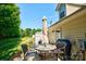 Outdoor patio features a dining set, grill, and manicured lawn at 1504 Harpers Inlet Dr, Lake Wylie, SC 29710