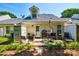 Back patio featuring an outdoor dining set, grill, and landscaping at 1504 Harpers Inlet Dr, Lake Wylie, SC 29710