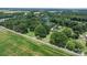 Aerial shot of the property and its surroundings, including a pool and green fields nearby at 151 Third Creek Rd, Statesville, NC 28677