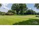 Vast green backyard offers ample space and complements the classic brick house at 151 Third Creek Rd, Statesville, NC 28677