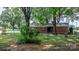 A charming fenced backyard features a well-maintained lawn and mature trees at 151 Third Creek Rd, Statesville, NC 28677