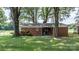 A charming fenced backyard with a covered area, featuring a well-maintained lawn at 151 Third Creek Rd, Statesville, NC 28677
