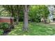 Spacious backyard featuring mature trees and shed at 151 Third Creek Rd, Statesville, NC 28677