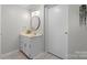 Clean bathroom featuring tile flooring, updated vanity with marble countertops, and traditional fixtures at 151 Third Creek Rd, Statesville, NC 28677
