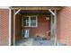 A covered area with classic brickwork, offering a blend of comfort and style at 151 Third Creek Rd, Statesville, NC 28677