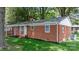 Charming brick home featuring mature trees, front porch and well maintained yard at 151 Third Creek Rd, Statesville, NC 28677