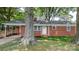 Charming single-story brick home featuring a covered carport and well-maintained front lawn at 151 Third Creek Rd, Statesville, NC 28677