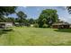 Expansive front yard featuring a lush lawn, mature trees and established landscaping in a neighborhood setting at 151 Third Creek Rd, Statesville, NC 28677