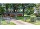 Charming brick home with a spacious front yard and a long driveway at 151 Third Creek Rd, Statesville, NC 28677
