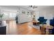 Open-concept living area with hardwood floors, fireplace, built-ins, and comfortable seating at 151 Third Creek Rd, Statesville, NC 28677