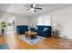 Cozy living room with hardwood floors, soft natural light, and comfortable seating for relaxing at 151 Third Creek Rd, Statesville, NC 28677
