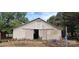 Exterior view of barn featuring double sliding doors and an attached ladder at 1521 N Piedmont Ave, Kings Mountain, NC 28086
