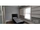 Cozy bedroom featuring built-in shelving and a bed frame with headboard at 1521 N Piedmont Ave, Kings Mountain, NC 28086