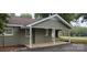 Exterior view of carport with brick and vinyl siding at 1521 N Piedmont Ave, Kings Mountain, NC 28086