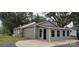 Exterior view of garage with gray siding and four windows at 1521 N Piedmont Ave, Kings Mountain, NC 28086