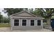 Garage exterior with four windows and gray siding at 1521 N Piedmont Ave, Kings Mountain, NC 28086