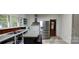 Kitchen with stainless steel refrigerator, built in shelves, and gray countertops provides space for cooking and storage at 1521 N Piedmont Ave, Kings Mountain, NC 28086