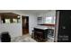 Functional kitchen area with a breakfast bar and seating, offering a casual dining and workspace option at 1521 N Piedmont Ave, Kings Mountain, NC 28086