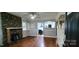 Bright living room featuring hardwood floors and a stone fireplace at 1521 N Piedmont Ave, Kings Mountain, NC 28086