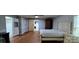 Bedroom with hardwood floors, barn door, and neutral color palette provides a relaxing personal retreat at 1521 N Piedmont Ave, Kings Mountain, NC 28086