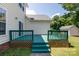 Backyard deck with green paint, steps to the lawn, and house siding at 1540 Coatsworth Ln, Rock Hill, SC 29732