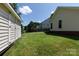 Spacious backyard featuring lush green lawn and a sturdy shed, adjoining the house at 1540 Coatsworth Ln, Rock Hill, SC 29732