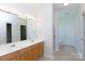 Bathroom features double sinks, vanity, and a glass-enclosed shower with a soaking tub at 1540 Coatsworth Ln, Rock Hill, SC 29732