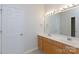 Bathroom featuring a double sink vanity, large mirror, and contemporary lighting at 1540 Coatsworth Ln, Rock Hill, SC 29732