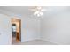 Bedroom featuring a ceiling fan, carpet, and view into attached bathroom at 1540 Coatsworth Ln, Rock Hill, SC 29732