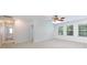 Bright bedroom with neutral carpet, ceiling fan, and natural light from dual windows at 1540 Coatsworth Ln, Rock Hill, SC 29732