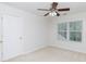 Bedroom with a ceiling fan, window, carpet and a white door to a closet at 1540 Coatsworth Ln, Rock Hill, SC 29732