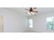 Well-lit bedroom with large windows, neutral carpet, and a ceiling fan at 1540 Coatsworth Ln, Rock Hill, SC 29732