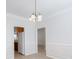 Dining room features decorative molding and a view to the kitchen at 1540 Coatsworth Ln, Rock Hill, SC 29732