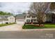 Well-maintained lawn and landscaping complement this two-story home with inviting curb appeal at 1540 Coatsworth Ln, Rock Hill, SC 29732