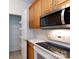 Kitchen features stainless steel appliances, white countertops, and an open pantry at 1540 Coatsworth Ln, Rock Hill, SC 29732
