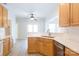 Kitchen with white counter tops, breakfast bar, stainless steel appliances and light wood cabinets at 1540 Coatsworth Ln, Rock Hill, SC 29732
