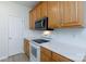 Kitchen features stainless steel appliances and white countertops at 1540 Coatsworth Ln, Rock Hill, SC 29732