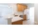 Bright kitchen features stainless steel appliances, white subway tile backsplash and breakfast bar at 1540 Coatsworth Ln, Rock Hill, SC 29732